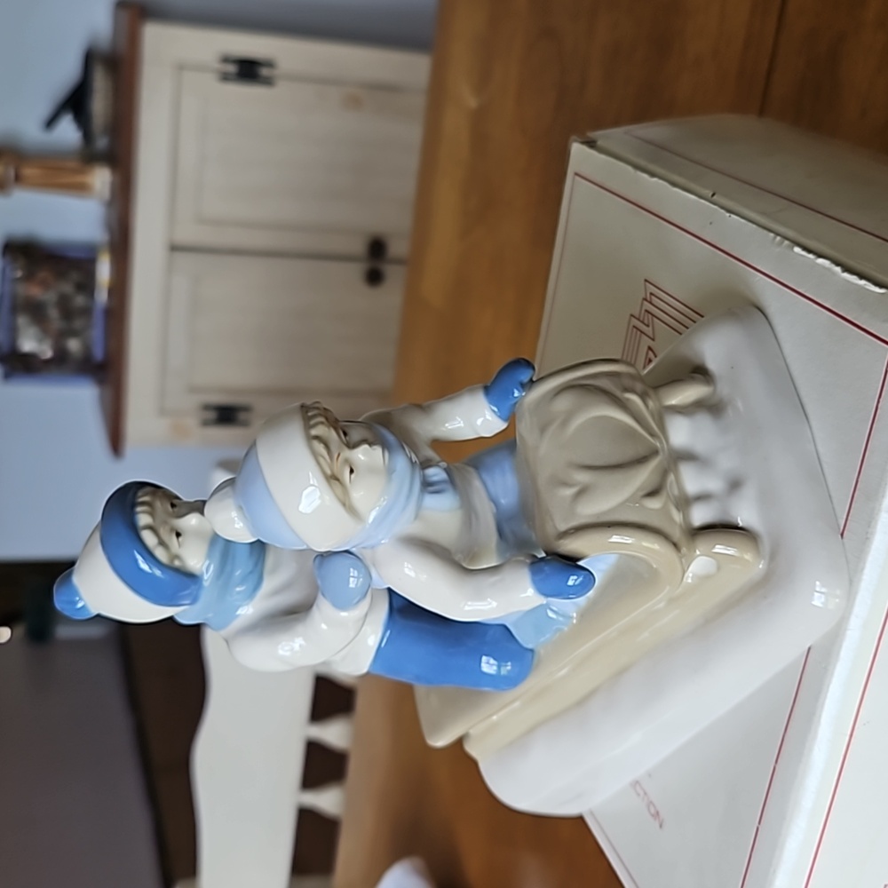 Paul Sebastian Fine Porcelain sledding figurine